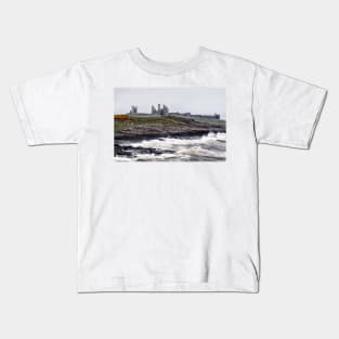 Rough waves battering the coast near Dustanburgh castle Northumberland, UK Kids T-Shirt